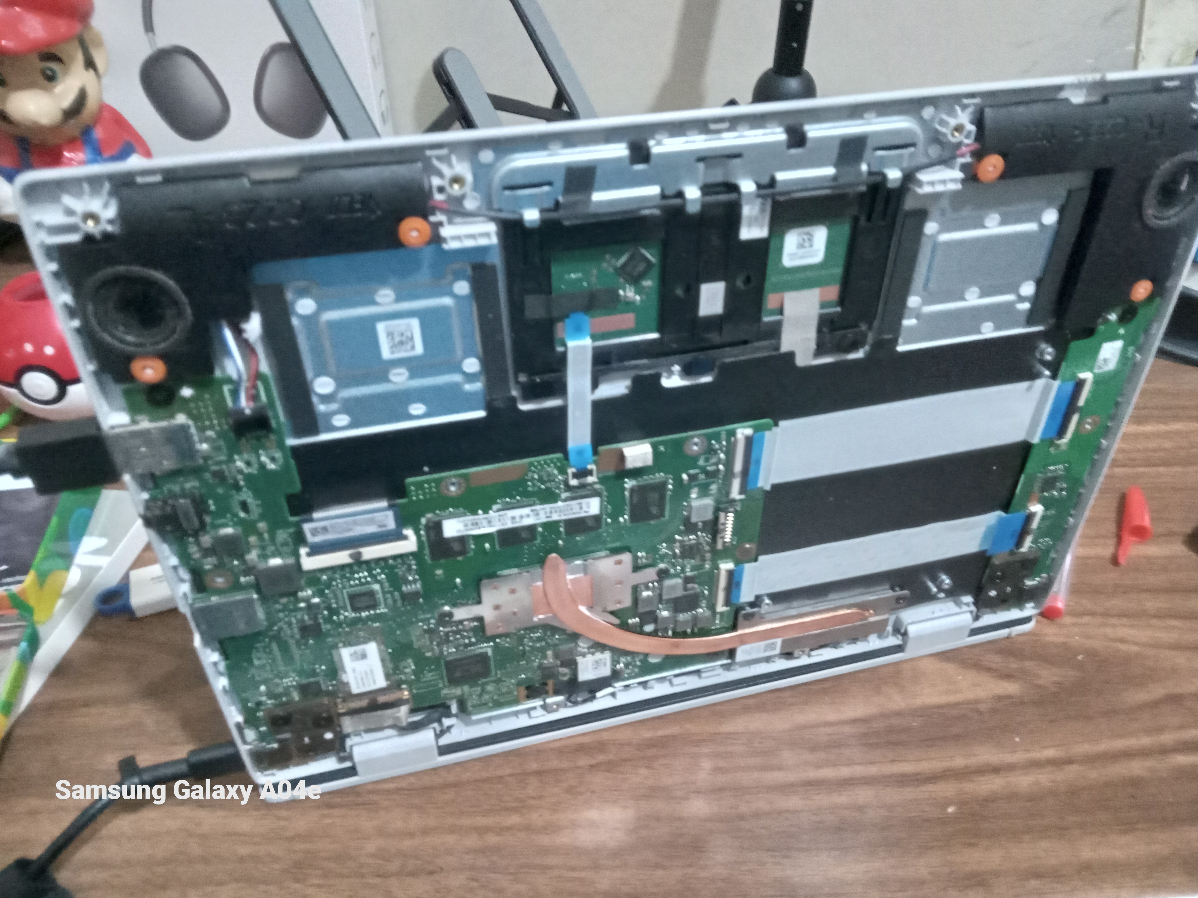 Inside of the ASUS Chromebook with the battery disconnected during the Developer Mode activation process